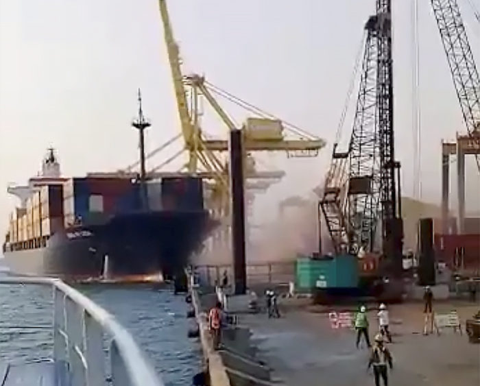 A crane collapses after the Soul of Luck ship slams into a pier in Tanjung Emas, Semarang, Indonesia July 14, 2019 in this still image taken from social media video. Shadam Makarim Wibisono via REUTERS   ATTENTION EDITORS - THIS IMAGE HAS BEEN SUPPLIED BY A THIRD PARTY. MANDATORY CREDIT. NO RESALES. NO ARCHIVES